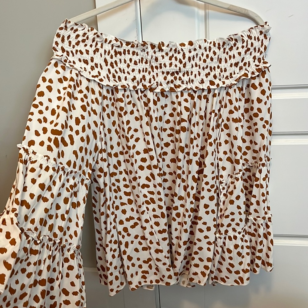 White and burnt orange belle sleeve off the shoulder blouse